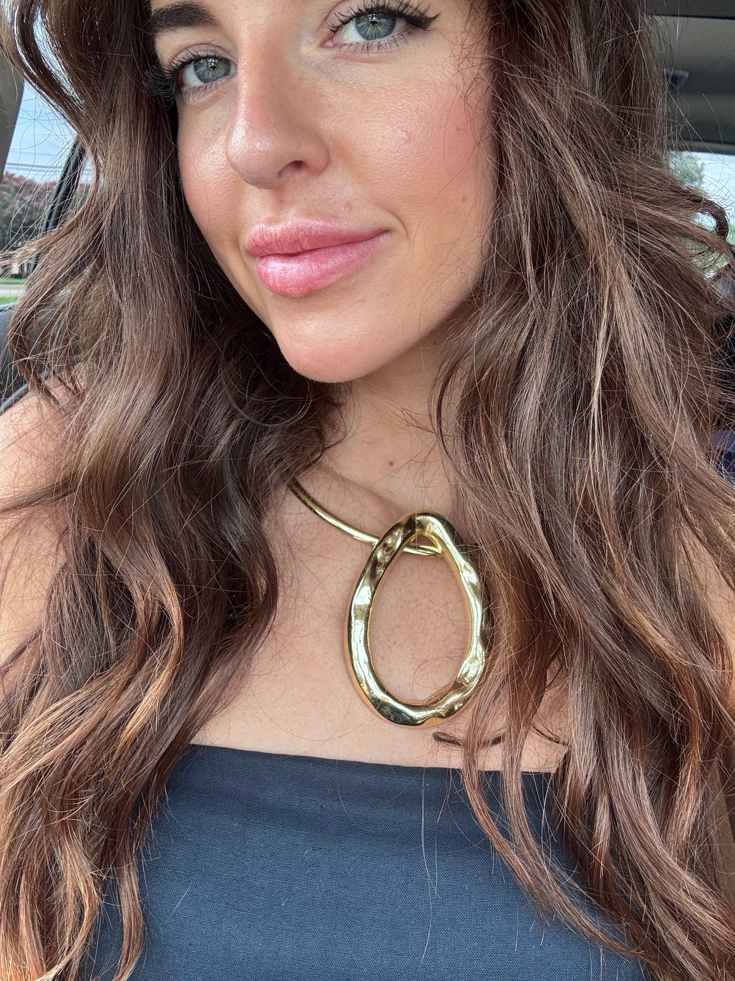 Woman wearing Chunky gold vintage necklace