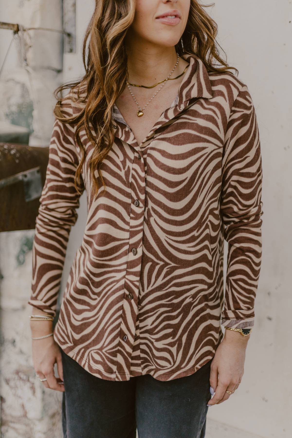 Brown zebra button up shirt on woman