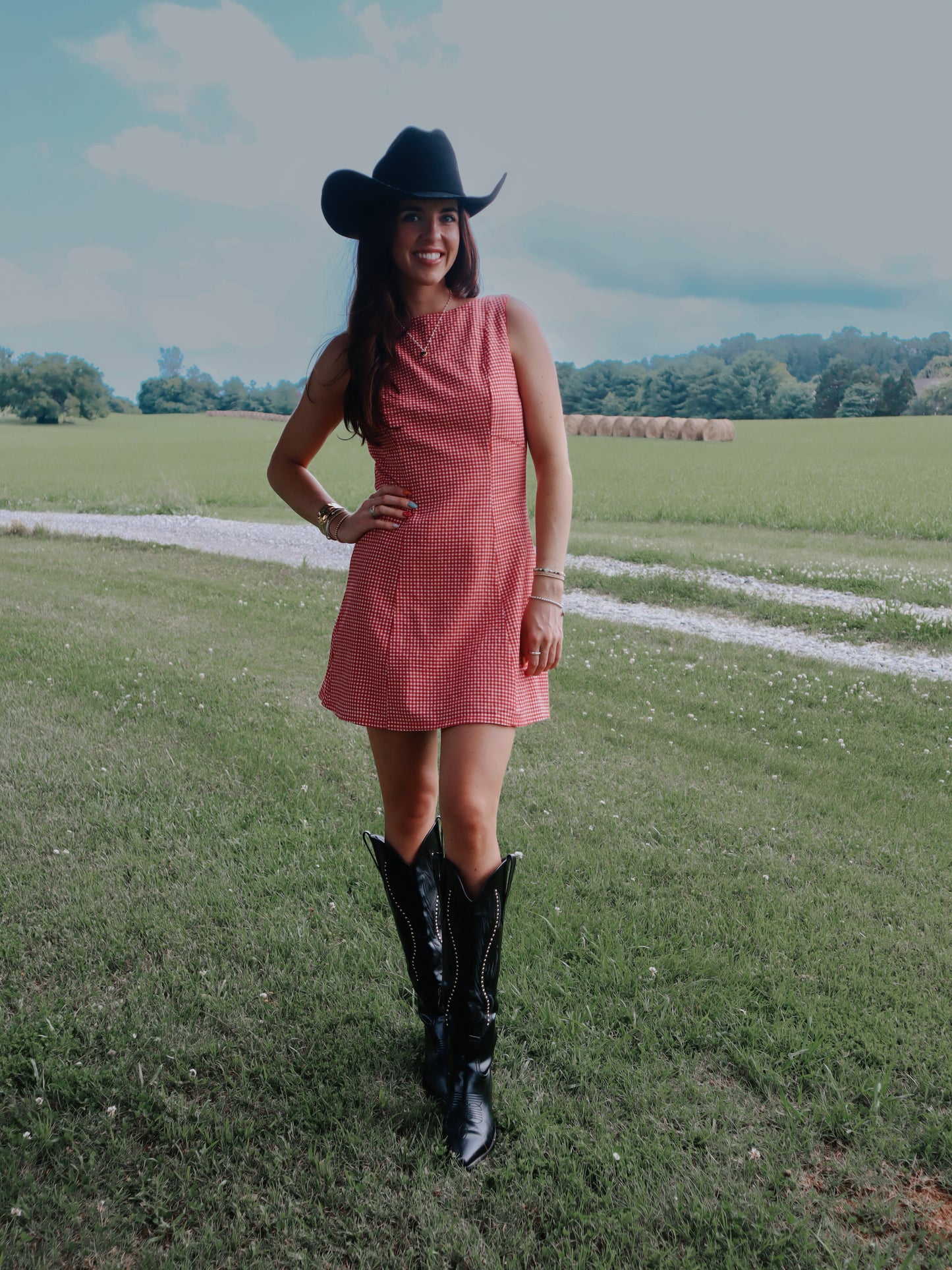 red gingham mini dress with cowboy boots