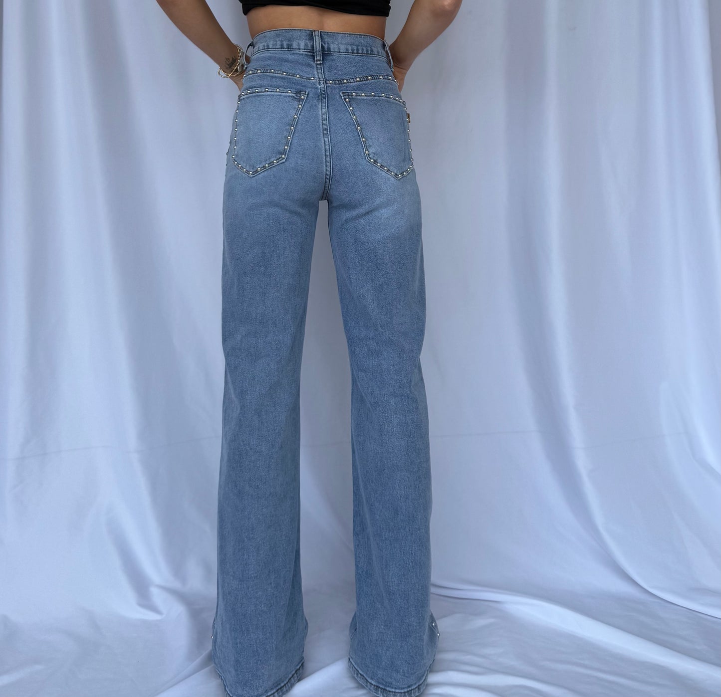 back of studded straight jeans for women.