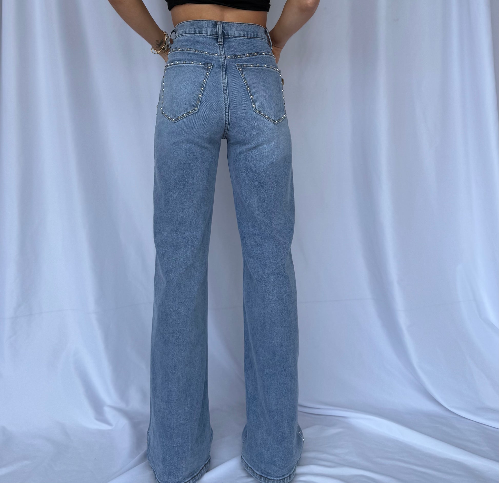 back of studded straight jeans for women.