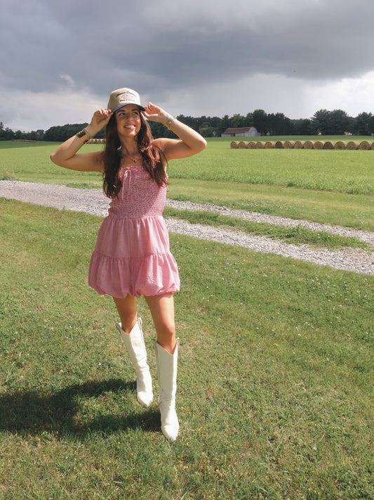 Red Gingham bubble hem romper. Thats strapless and styled in the summer